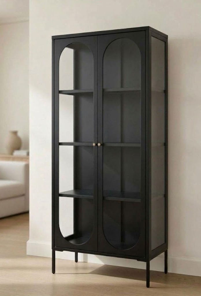 JIRAH black display cabinet with arched glass doors, shelves, and slim legs