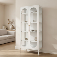 White JIRAH display cabinet with gold handles, arched glass doors, and displayed tableware